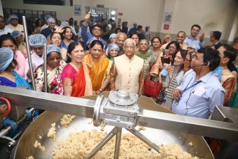 Dignitaries on a tour of the kitchen facilities