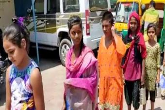 People wait in a line for food
