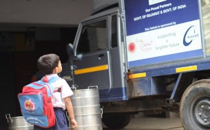 A Child Having A Look At The Akshaya Patra Mid Day Meal Van Which Is Supporting His Education